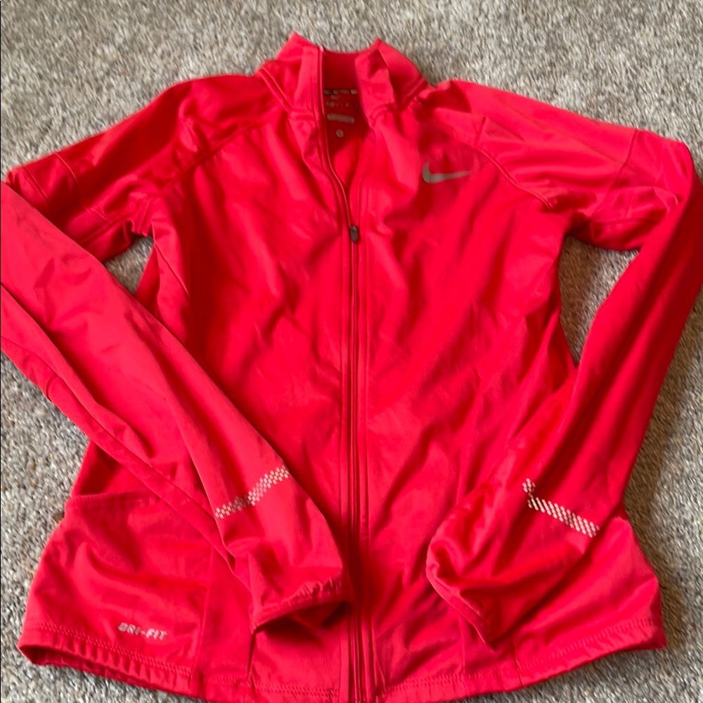 Nike Women's Red Running Dri-Fit Jacket with Thumb Holes. Fitted style